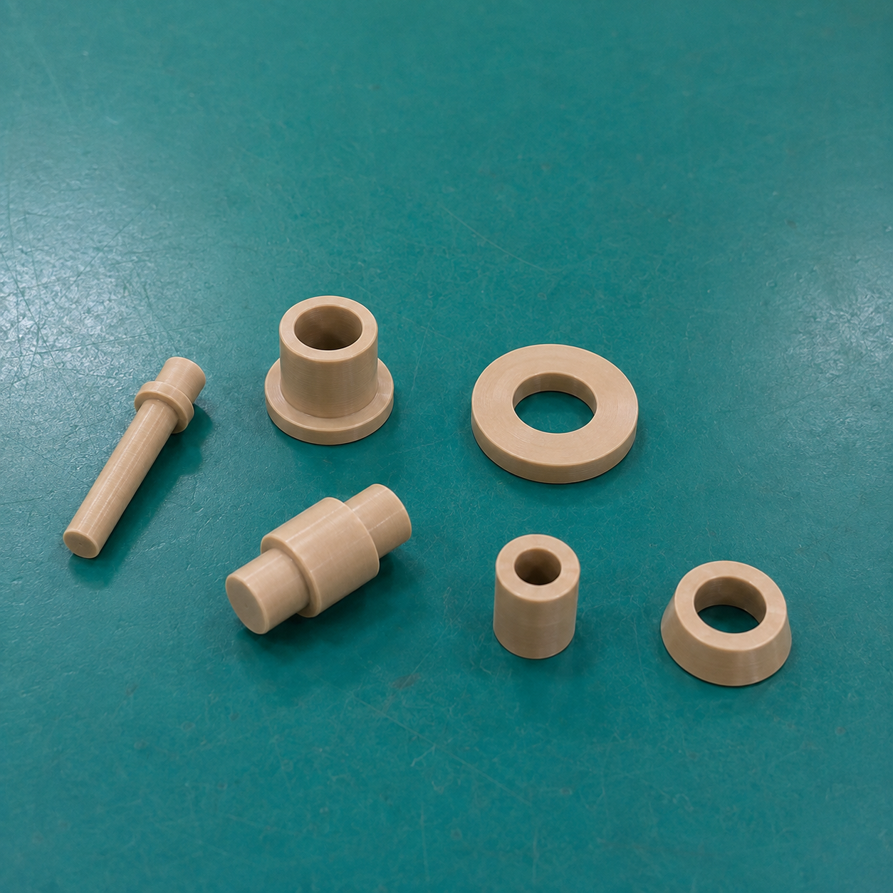 Natural and black PEEK CNC turned components