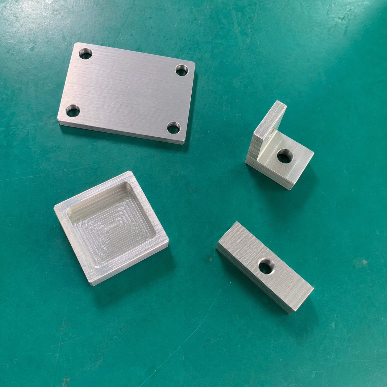 CNC machining engineering support with mechanical CAD drawings, aluminum machined parts and precision measuring tools